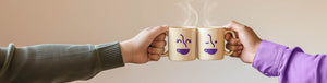 Contact Us hero -- two individuals tapping rebranded Coffee Bean Direct mugs together