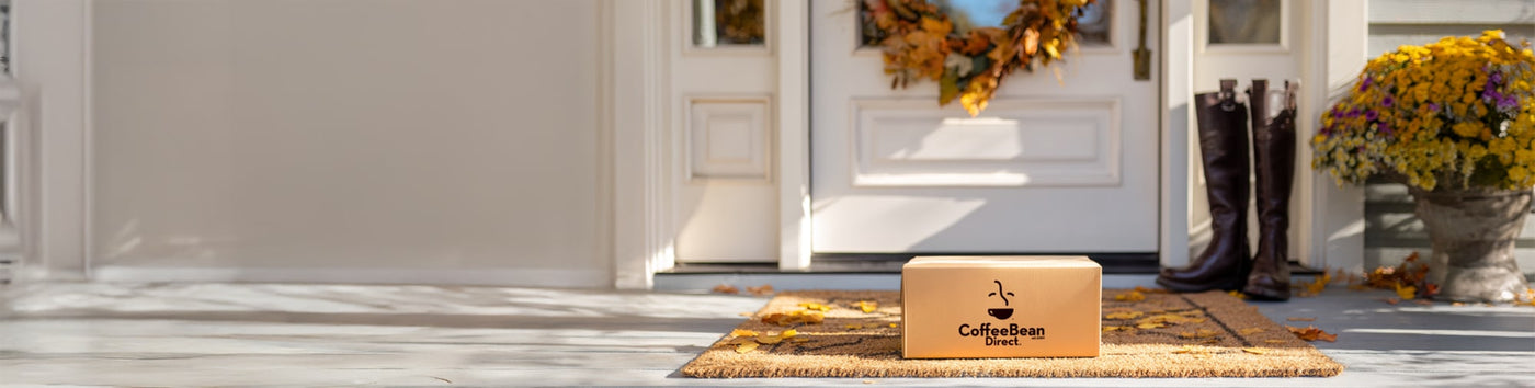 10% Subscription Discount Upgrade featured hero -- Coffee Bean Direct delivery box on a porch with an Autumn background