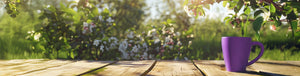 August Roaster's Blend featured hero --purple mug on a wooden deck with a garden background