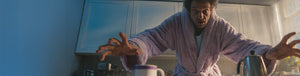 Zombie Cure featured hero -- man in bath robe reaching for coffee in the kitchen with eyes wide open
