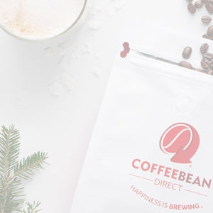 Gift Subscription mobile -- opened coffee bag with beans spilling out next to a mug of coffee and pine tree leaves