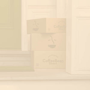 Subscription Landing Page Featured Mobile Hero with cream overlay -- Coffee Bean Direct delivery boxes on porch of residence